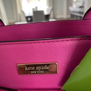 KATE SPADE Hot pink purse with bow.   black and white polka dot lining.